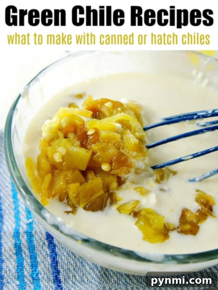 Bowl of cream with chopped green chiles, mixed with a blue whisk on a blue towel—perfect for your green chile chicken casserole. Text: Green Chile Recipes.