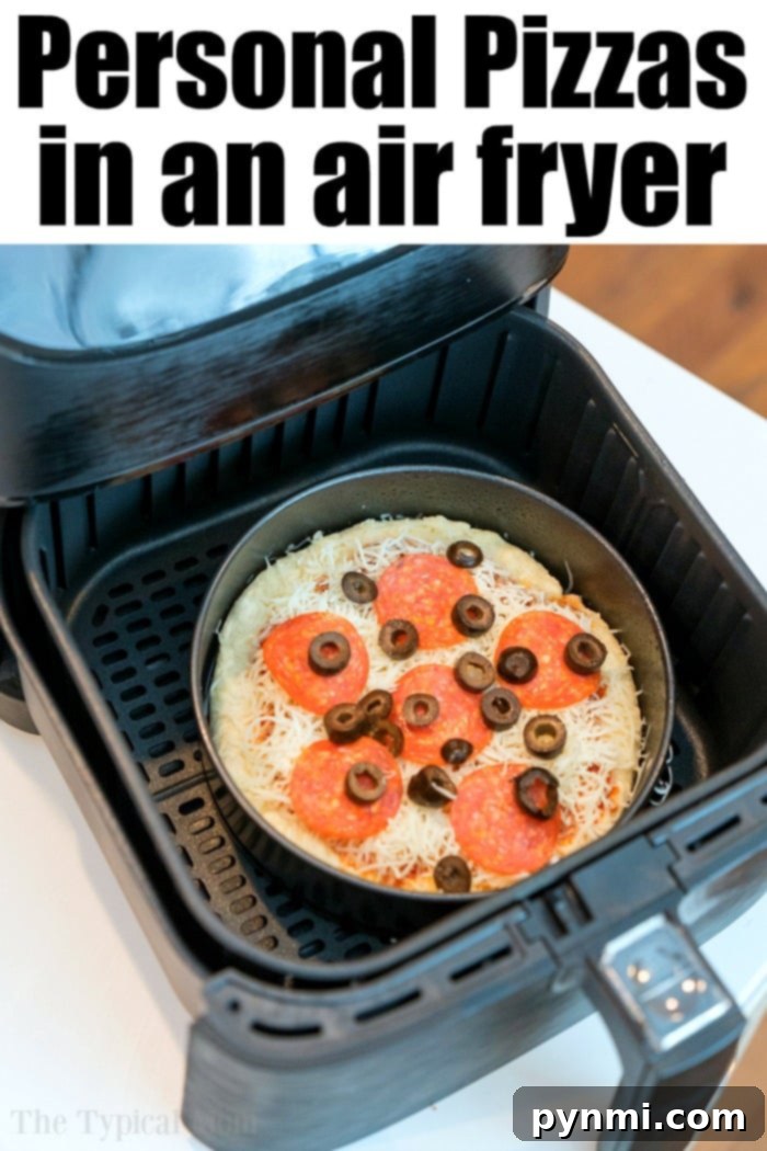 Sliced homemade air fryer pizza with pepperoni and olives.