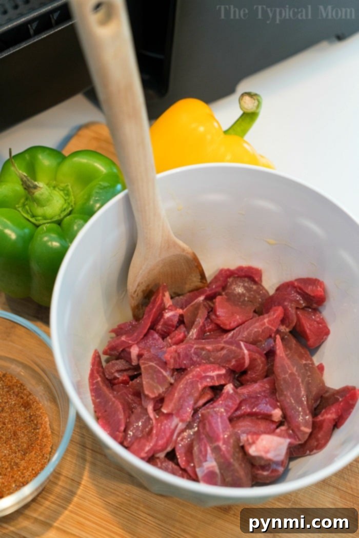 Craft Your Own Fajita Spices 3 Air fryer fajitas cooking with vibrant vegetables and seasoned meat