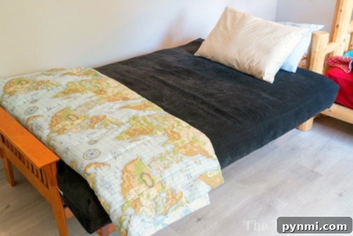 Futon chair bed converting from a stylish seat to a comfortable bed.