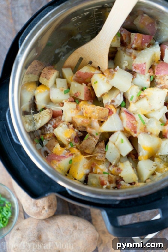 Instant Pot Cheesy Bacon Ranch Potatoes, a creamy and savory side dish with bacon bits and a hint of ranch seasoning.