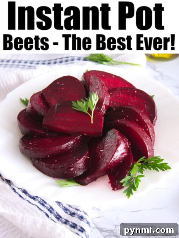 Freshly cooked Instant Pot beets, vibrantly colored and sliced, presented in a rustic bowl on a wooden surface.