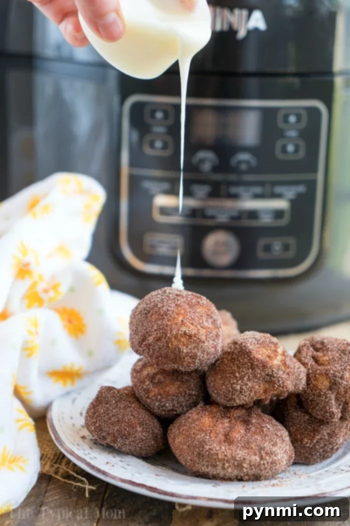 Fluffy Air Fryer Donut Bites 10 Air fryer donuts freshly made and glistening with sugar.