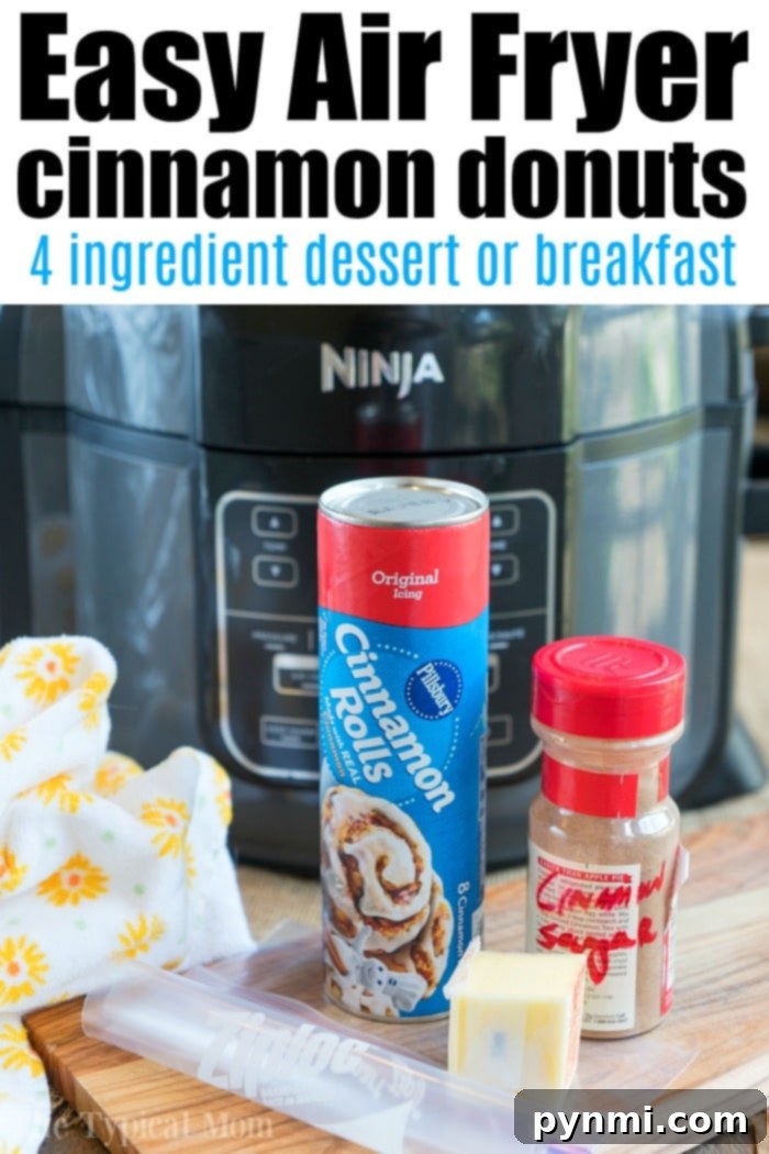 Air fryer donut recipe using cinnamon rolls and cinnamon and sugar! Soft on the inside and crispy outsides, make these in your Ninja Foodi tonight! #airfryer #airfryerrecipe #donuts #cinnamonrolls #ninjafoodi #ninjafoodirecipes #dessert Ninja Foodi donuts fresh out of the air fryer, coated with cinnamon sugar.