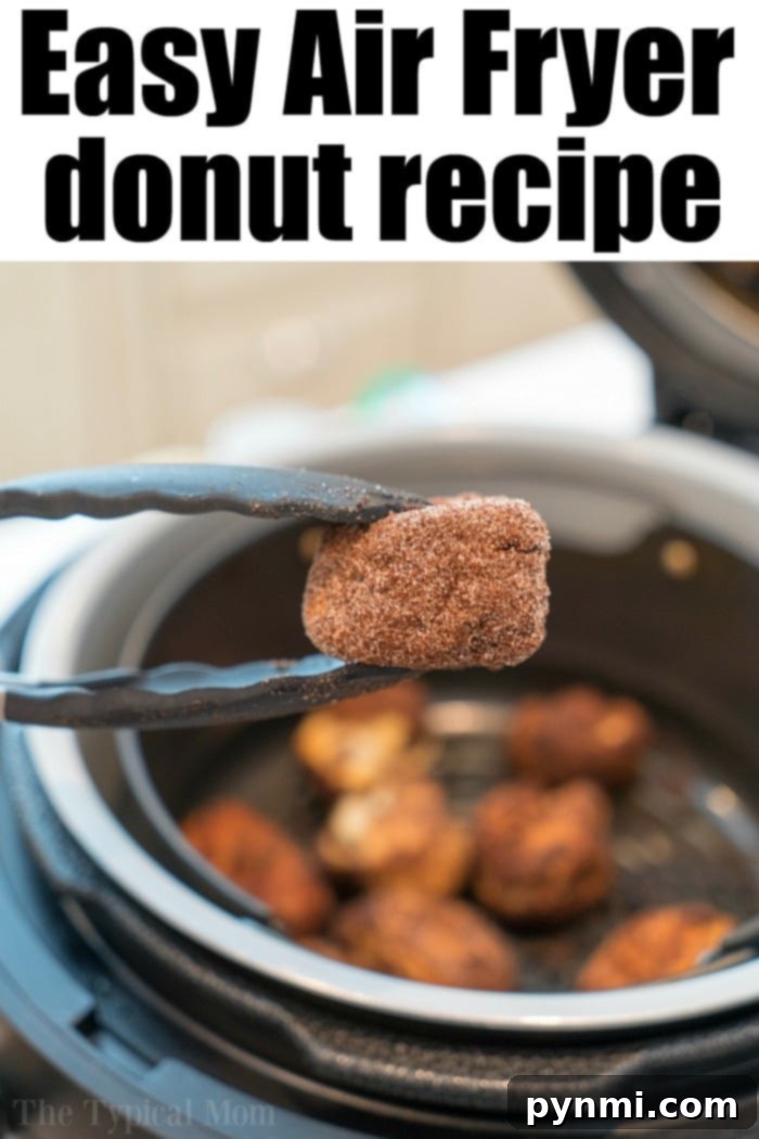 Air fryer donuts using cinnamon rolls and cinnamon and sugar! Soft on the inside and crispy outsides, make these in your Ninja Foodi tonight! #airfryer #airfryerrecipe #donuts #cinnamonrolls #ninjafoodi #ninjafoodirecipes #airfryerdonuts Ninja Foodi donut recipe showcasing perfectly air-fried donut holes.