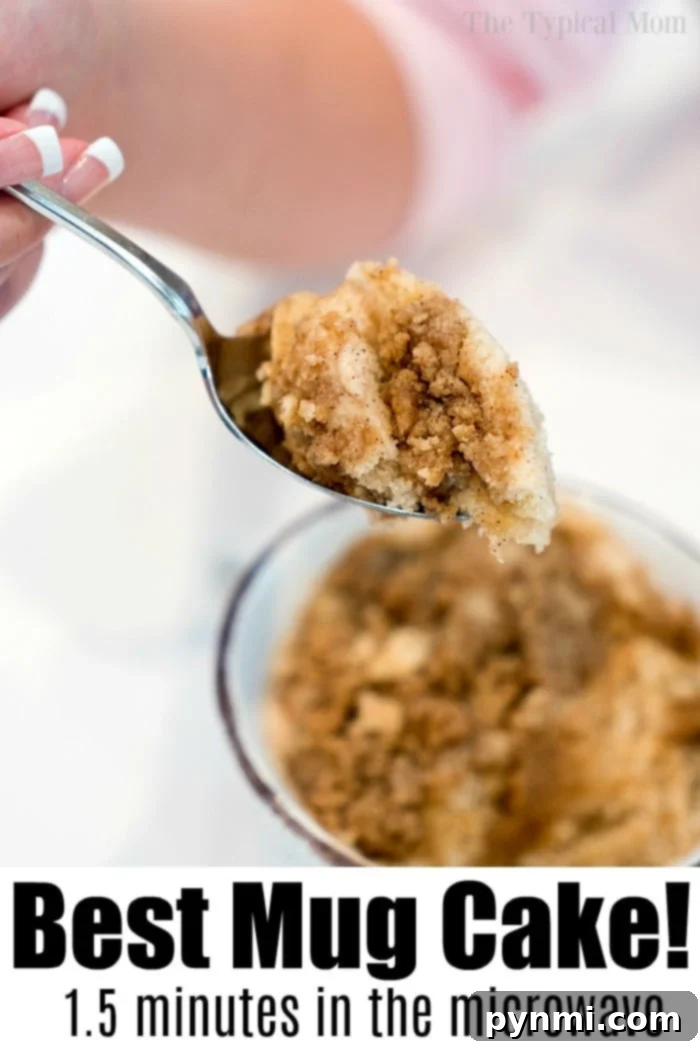 A spoonful of crumbly mug cake above a bowl with text: Best Easy Mug Cake Recipe! Just 1.5 minutes in the microwave.