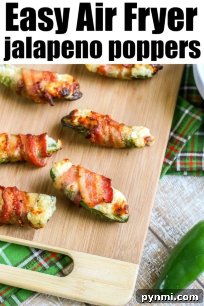 Air fryer jalapeno poppers, filled with cheese and wrapped in crispy bacon.