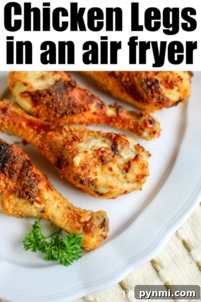 Air fryer chicken legs are crispy on the outside but tender and juicy on the inside. Copycat Kentucky Fried Chicken without the oil! #airfryerrecipes #airfryerchicken #chickenlegs #thetypicalmom #ninjafoodirecipes A serving of air fryer chicken legs, showing the golden, crispy exterior.