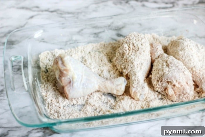 Crispy Buttermilk Chicken Legs in Your Air Fryer 5 A plate of golden, crispy air fryer chicken legs, garnished and ready to serve.