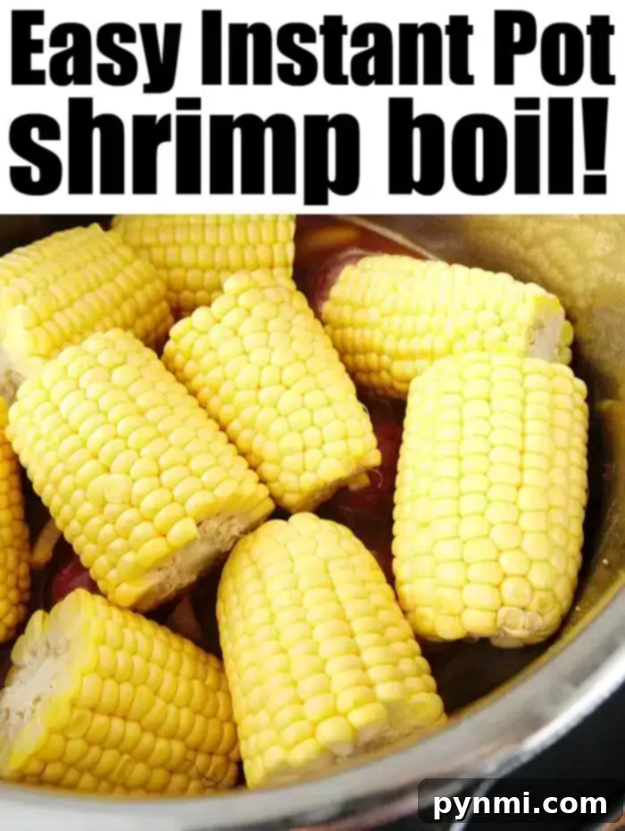 Instant Pot shrimp boil is a healthy dinner you can throw together in no time. If you love seafood and your pressure cooker you've gotta try this. A close-up of a pressure cooker full of frozen shrimp, corn, and potatoes, illustrating the frozen shrimp boil in Instant Pot preparation.