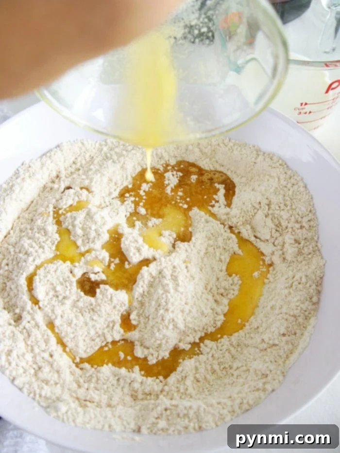 Best Instant Pot dump cake you can make in your pressure cooker in no time. The perfect fruit dessert with a crumble topping you've got to try tonight! A bowl of Instant Pot peach cobbler with a fork.