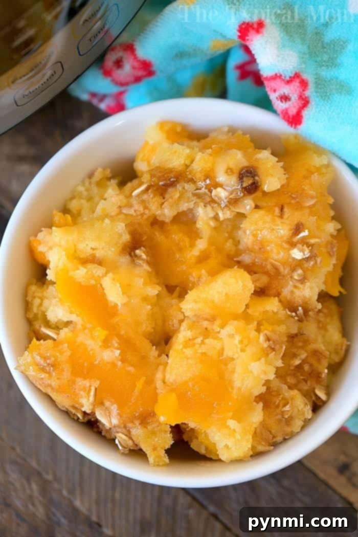Instant Pot peach cobbler. #instantpot #peachcobbler Instant Pot peach cobbler in a serving dish, ready to be enjoyed.