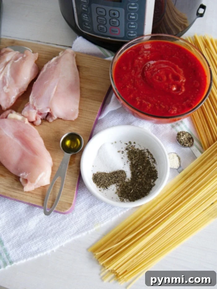 Instant Pot Chicken Parmesan Perfection 4 Close-up of chicken parmesan in an Instant Pot, no breading, showcasing melted cheese and rich sauce.