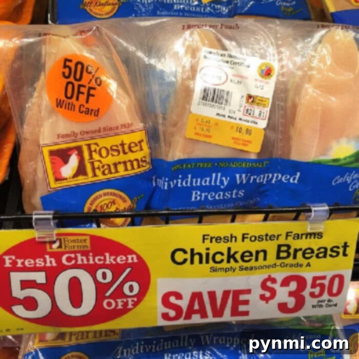Instant Pot Chicken Parmesan Perfection 5 A display of Foster Farms individually wrapped chicken breasts with a discount label showing '50% Off with Card.' The yellow sign below reads, 'Fresh Foster Farms Chicken Breast, Save $3.50.' Perfect for your next Instant Pot chicken parmesan! The packaging features the Foster Farms logo.