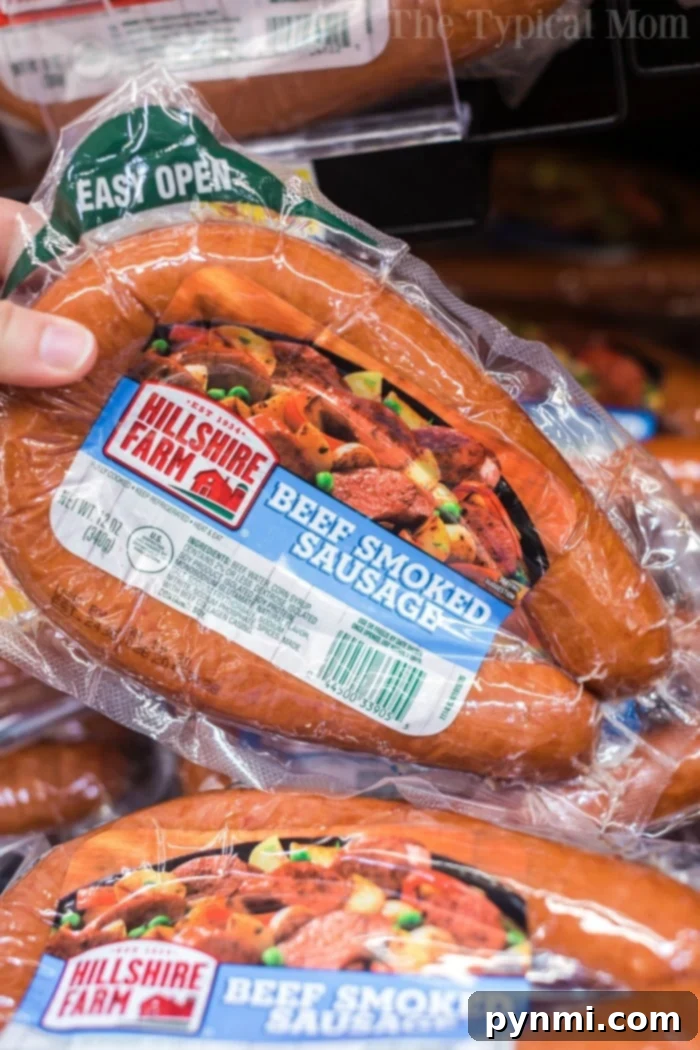 Sausage and rice casserole is so good! A cheesy casserole packed with smoked sausage, tender rice and vegetables cooked all in one pot in no time at all. #instantpot #instantpotrecipes #sausage #rice #casserole #cheesy #pressurecooker #ninjafoodi Package of Hillshire Farm beef smoked sausage displayed in a store aisle, perfect for a quick and tasty meal.