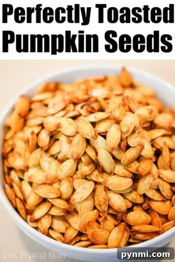 Perfectly Roasted Pumpkin Seeds 7 A bowl of roasted pumpkin seeds, perfectly golden and ready to be served, accompanied by a festive autumn pumpkin.