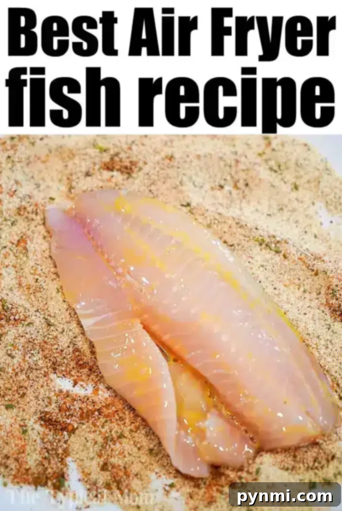 Air fryer tilapia is easy to make! Using fresh, frozen, or previously frozen fillets you can make tasty fish that's crunchy on the outside and flaky within. #airfryer #airfryerfish #airfryerrecipes #ninjafoodi #ninjafoodirecipes #tilapia #airfryertilapia A raw tilapia fillet is shown on a layer of seasoned breadcrumbs, ready to be coated for the air fryer.