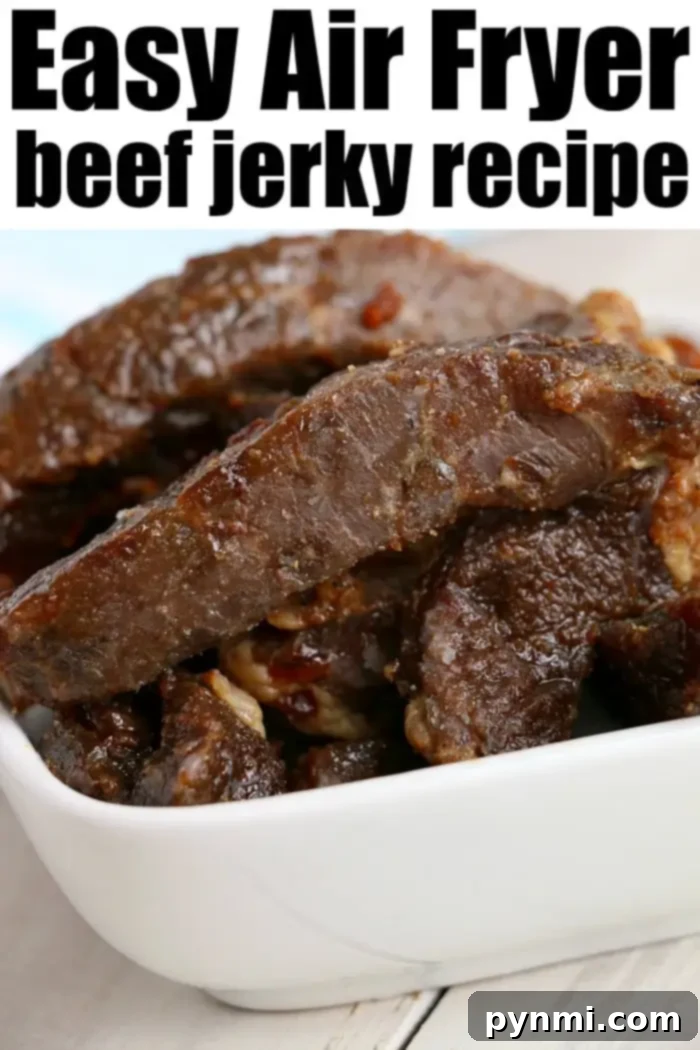 A close-up of a white bowl filled with pieces of dark brown beef jerky.