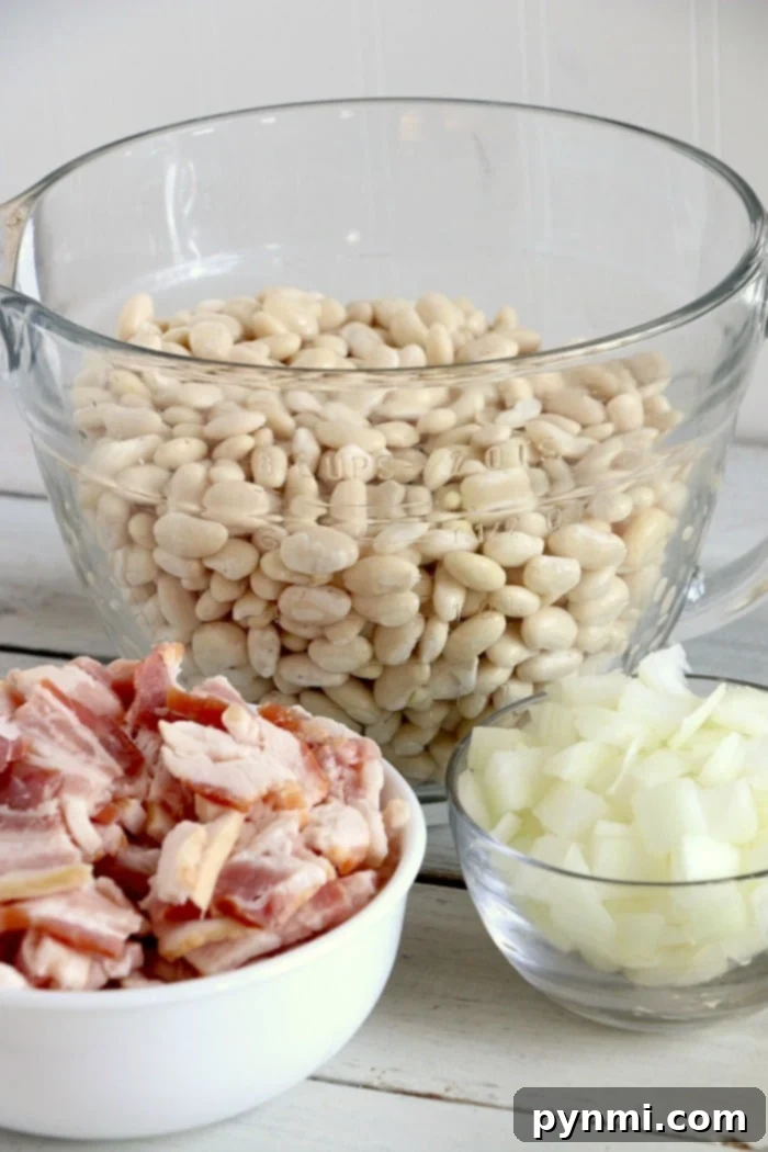 Slow cooker baked beans recipe is homemade using dry beans, and so much better than canned! You'll never buy them at the store again after trying these. #crockpotrecipes #crockpotbakedbeans #bakedbeans #slowcooker #homemadebakedbeans #homemade #sidedsih crockpot baked beans recipe