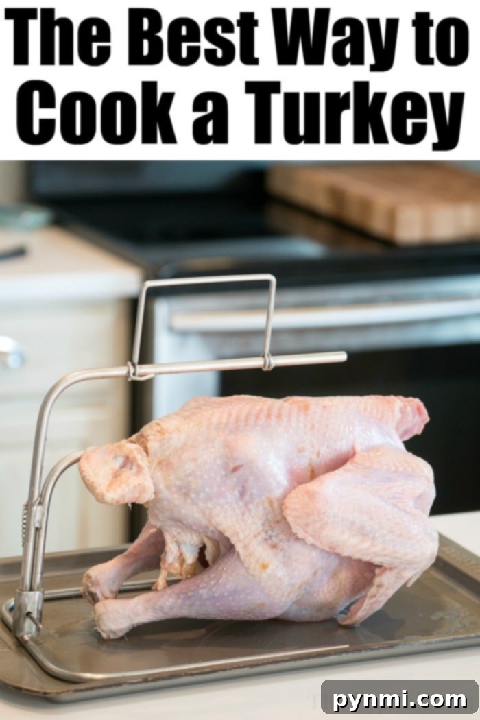 A raw, generously seasoned turkey, coated with a flavorful rub and butter, is ready for roasting on a rack inside a baking tray. The image evokes anticipation of a perfectly cooked holiday meal.