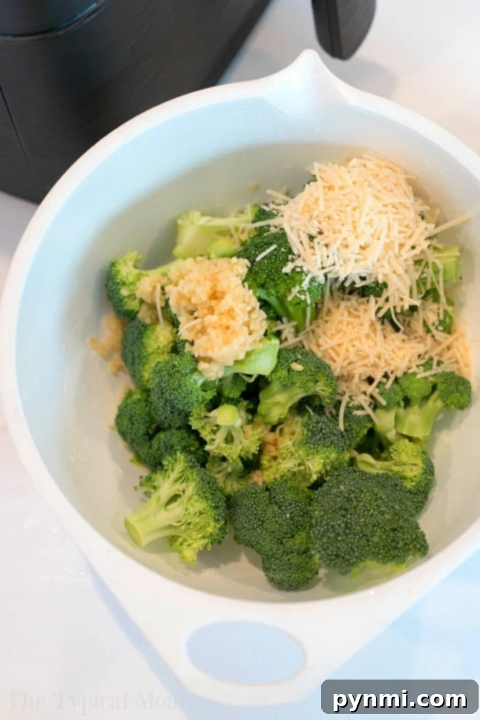 Broccoli in air fryer is quite easy. Toss it in parmesan and olive oil for a crispy cheesy taste that's a great side dish with any meal. #airfryerrecipes #ninjafoodirecipes #foodi #foodirecipes #airfryerbroccoli #broccoli #airfryervegetables #ninjafoodibroccoli Broccoli in the Air Fryer, perfectly cooked and ready to serve
