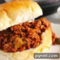 A delicious Instant Pot Sloppy Joe sandwich with savory meat filling on a sesame seed bun, ready to be enjoyed.