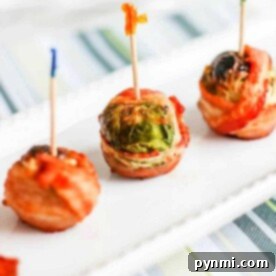 Golden Air Fried Bacon Wrapped Sprouts 8 Three crispy Brussels sprouts with bacon on a plate