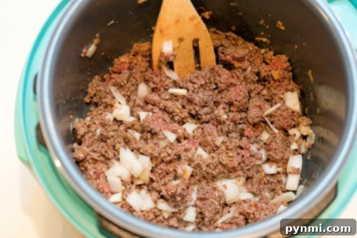 Ultimate Instant Pot Enchilada Casserole 3 Savory ground beef prepared for Instant Pot Enchilada Casserole.