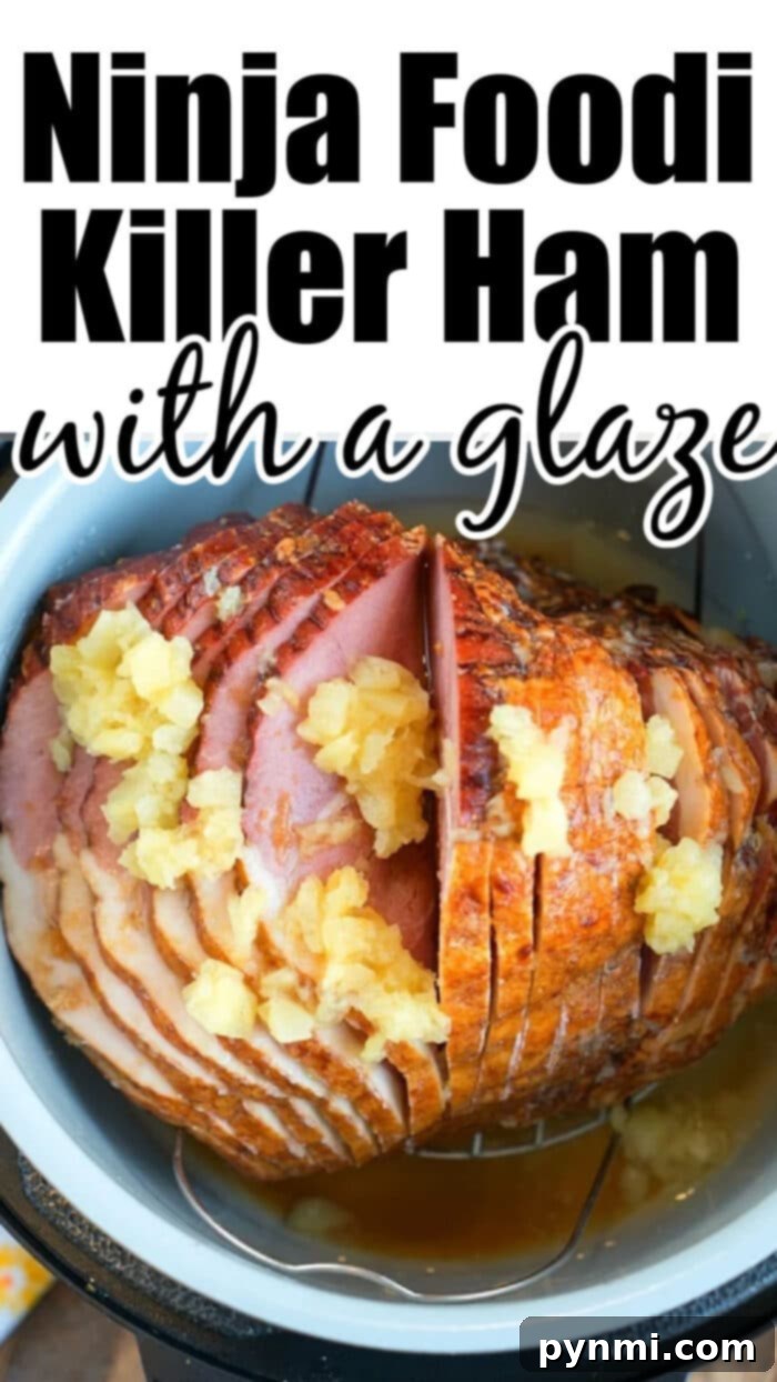 Sliced Ninja Foodi ham with pineapple and glaze, ready to be served.