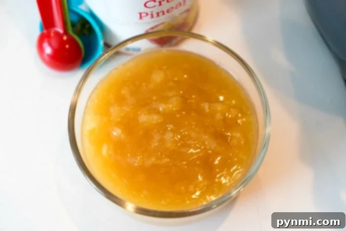 A vibrant pineapple glaze being prepared, perfect for a Ninja Foodi ham.