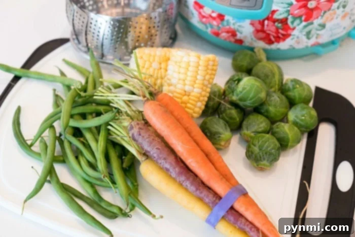 Close-up of perfectly steamed mixed vegetables in a bowl. Instant Pot Mixed Vegetables