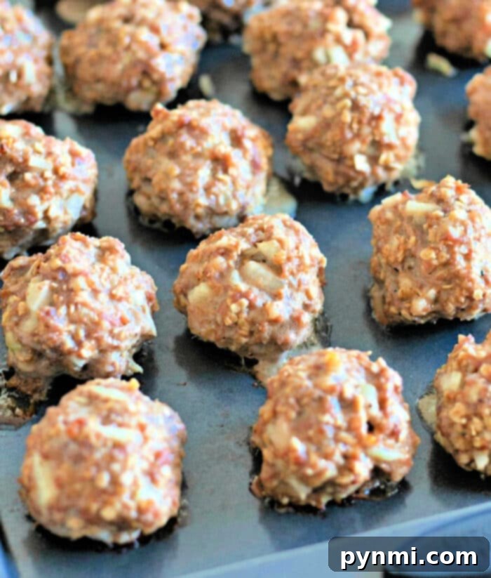 Simple Breadcrumb-Free Meatballs 2 Meatballs Recipe Without Breadcrumbs - Golden brown, baked meatballs ready to be served