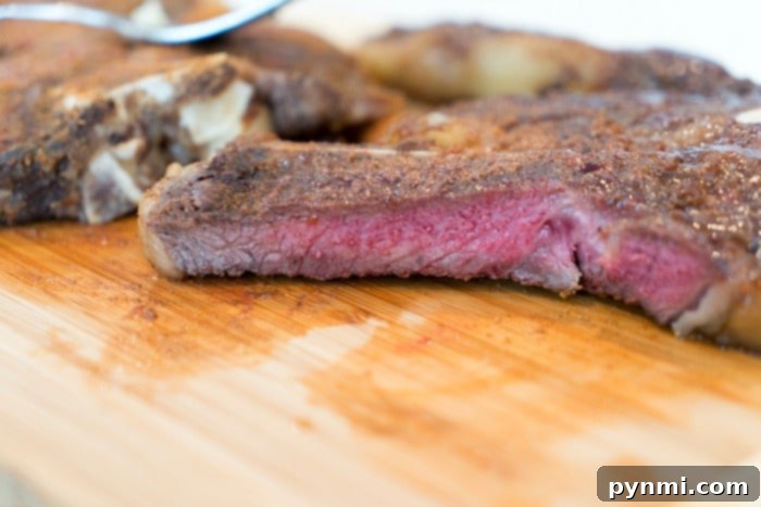 Ninja Foodi Feast: Steak and Creamy Mash 5 perfectly cooked steak sliced on a cutting board