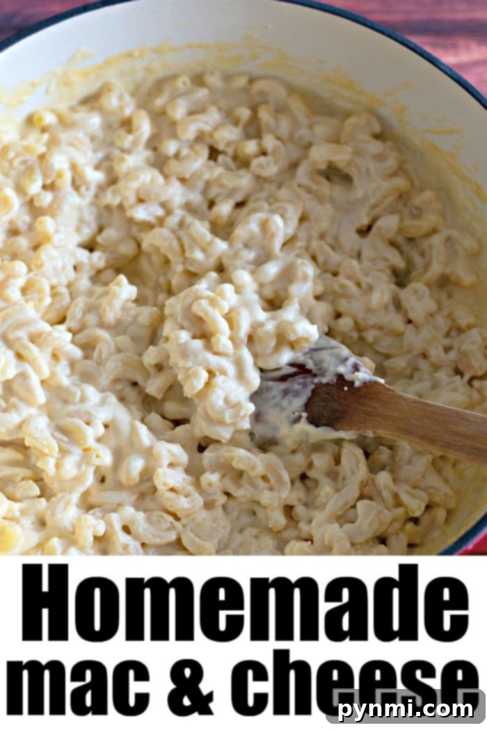 Homemade macaroni and cheese served in a rustic bowl, with a fork digging into the creamy goodness.