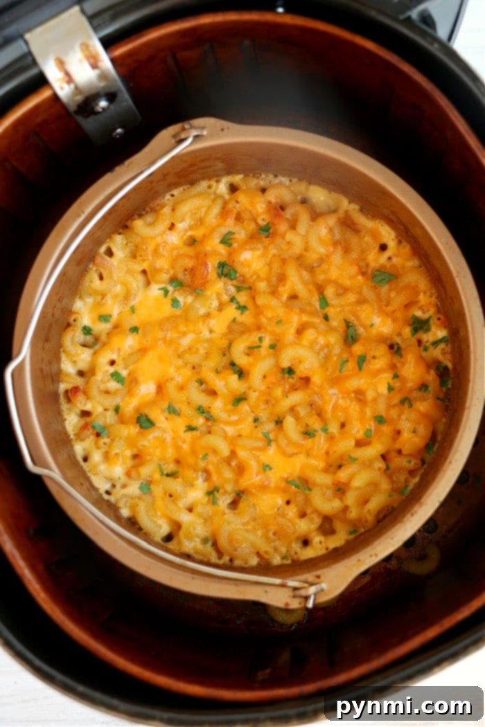 Crispy air fryer macaroni and cheese with a golden-brown topping, served in a small bowl.