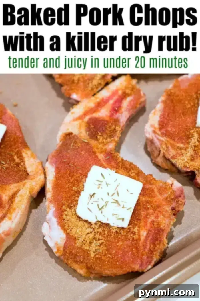 Raw pork chops with a dry rub seasoning are on a baking sheet. Each chop has a pat of butter and herbs on top, showcasing the best baked pork chops. The text above reads: "Baked Pork Chops with a killer dry rub! Tender and juicy in under 20 minutes.