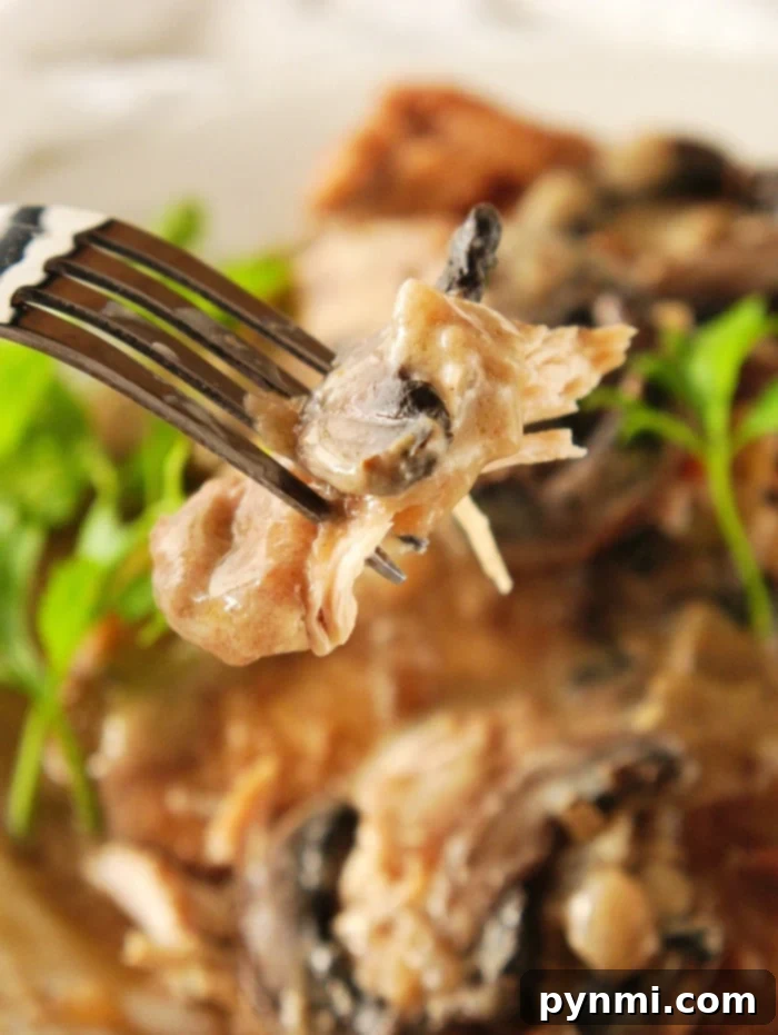 Delicious pressure cooker chicken marsala with tender chicken and creamy mushroom sauce, garnished with parsley.