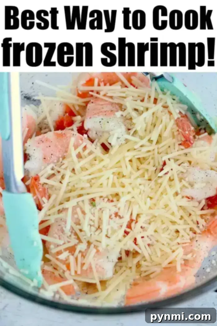 Best air fryer shrimp comes out tender and delicious in no time at all! Forget to defrost dinner? NO problem in your Ninja Foodi or other brand. Try this! #airfryer #airfryershrimp #shrimp #ninjafoodi #ninjafoodishrimp #frozenshrimp Bowl of jumbo frozen shrimp with grated cheese, alongside blue tongs. Text above reads: Best Way to Cook Frozen Shrimp! Try air-fryer frozen shrimp for a crispy twist.