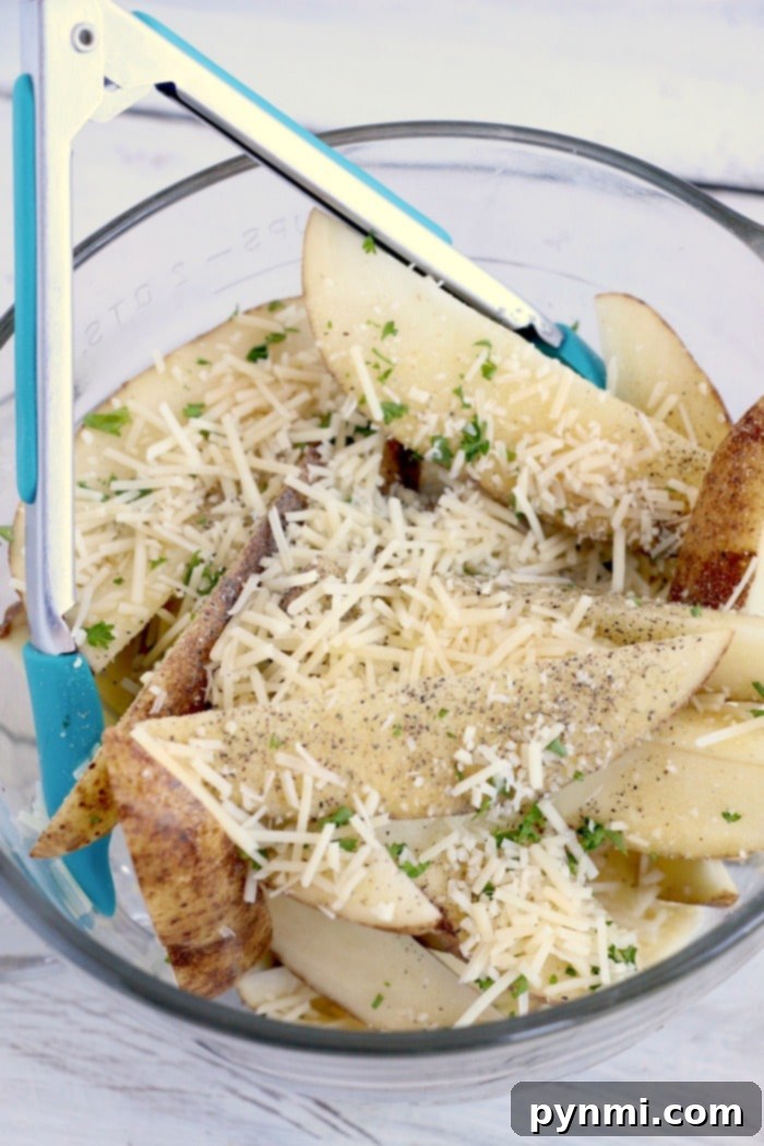 How to make air fryer potato wedges. The best side dish or snack. Just slice and cook with some olive oil and parmesan for a mouth watering bite you'll love. potato wedges air fryer