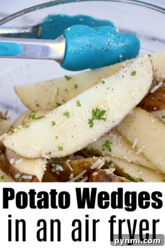 Air fryer potato wedges are the best side dish or snack. Just slice and cook with some olive oil and parmesan for a mouth watering bite you'll love. Close-up of seasoned air fryer potato wedges in a bowl with blue tongs. Text: Potato Wedges in an Air Fryer.