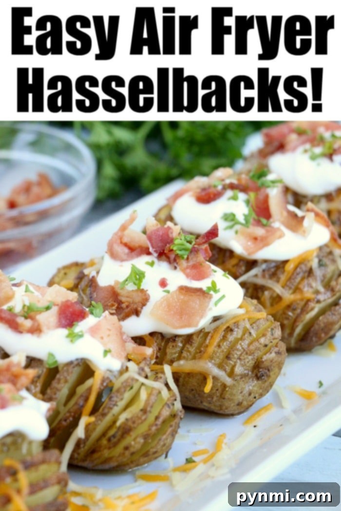 Easy air fryer hasselback potatoes are little bites of heaven! Crispy baked potatoes loaded with cheese and bacon and then topped with sour cream and chives. #airfryer #ninjafoodi #foodi #hasselbackpotatoes #bakedpotatoes #airfryerrecipes Crispy air fryer hasselback potatoes topped with sour cream, crispy bacon, and fresh herbs grace a white plate.