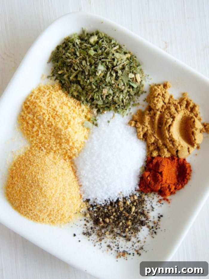 A vibrant collection of Mexican spices, including chili powder, cumin, and garlic powder, arranged artfully on a wooden board, ready to infuse any dish with authentic flavor.