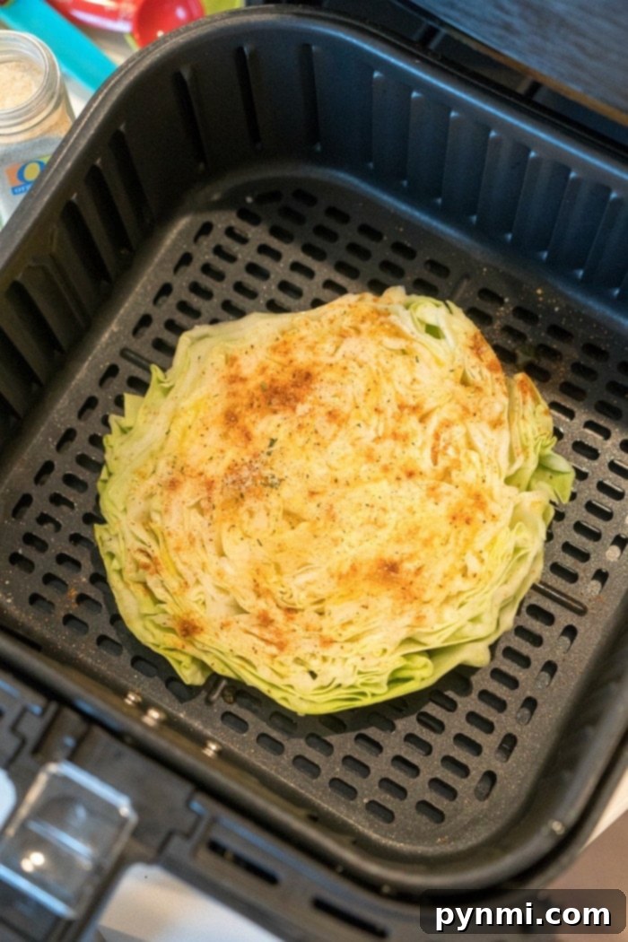 Air fryer cabbage steaks or quarters come out tender yet crispy on the edges with LOTS of flavor. If you love this vegetable, this is a new way to try it. #airfryer #airfryerrecipes #airfryercabbage #ninjafoodi #cabbage #cabbagesteaks cabbage recipe