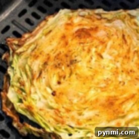 Crisp air fryer cabbage, perfectly grilled in the basket, seasoned and browned at the edges.
