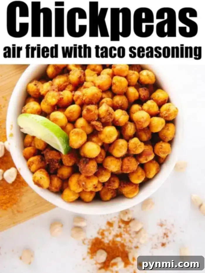 Crispy air fryer chickpeas are a fantastic high-protein, flavorful snack that cooks quickly. Ideal for healthy eating on the go. #airfryerchickpeas #chickpeas #airfryer #airfryerrecipes #ninjafoodi A bowl of crispy air fryer chickpeas, perfectly seasoned and ready for serving.