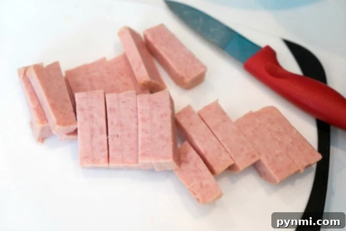 Crispy Fried SPAM slices in an air fryer basket