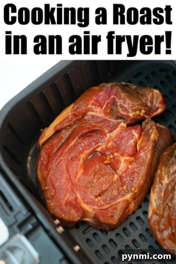 Raw seasoned beef roast slices, perfectly arranged without overlapping, nestled in an air fryer basket, ready for cooking. The text "Mastering the Air Fryer Roast!" is visible above.