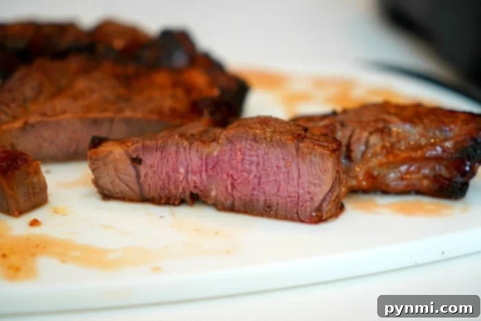 Perfectly cooked teriyaki roast beef slices, showcasing a tender interior and caramelized edges, ready to be enjoyed as a delicious air fryer meal.