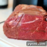 Air fried teriyaki beef roast, perfectly cooked and sliced, served as a main dish.