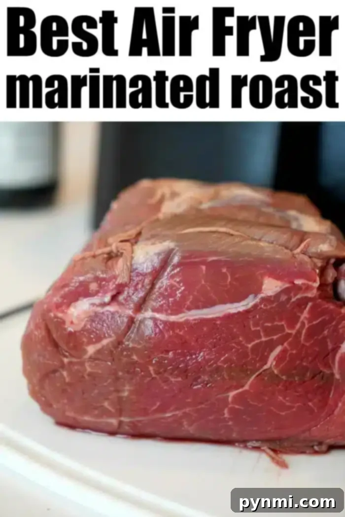Raw marinated beef roast on a white background, highlighted by text reading "Best Air Fryer Roast: Experience the Perfect Air Fryer Roast Beef."